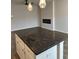 A gray kitchen island features cabinets and drawers at 107 Meadowview Dr # 23, Temple, GA 30179