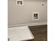 Laundry connections near a white drain pan on a wood floor at 107 Meadowview Dr # 23, Temple, GA 30179