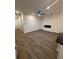The modern living room features luxury vinyl floors and a sleek ceiling fan at 107 Meadowview Dr # 23, Temple, GA 30179