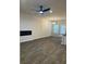 The living room has hardwood floors, an electric fireplace, and a modern ceiling fan at 107 Meadowview Dr # 23, Temple, GA 30179