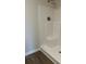 A clean, bright shower with a built-in seat and updated fixture at 107 Meadowview Dr # 23, Temple, GA 30179