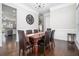 Bright dining room with hardwood floors, neutral walls and a modern chandelier at 5453 Battery Ln #20 Ln, Atlanta, GA 30342