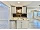 Kitchen boasts white cabinets, granite countertops, and a dishwasher at 225 Bayswater Dr, Suwanee, GA 30024