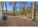 Backyard view featuring mature trees, natural landscape, and plenty of space at 1723 Capistrana Pl, Decatur, GA 30032