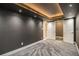 A carpeted basement with decorative ceiling and recessed lighting at 1723 Capistrana Pl, Decatur, GA 30032