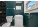Chic bathroom featuring black subway tile wall and modern fixtures at 1723 Capistrana Pl, Decatur, GA 30032