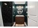 This stylish bathroom features black subway tile in the shower and a floating vanity with a vessel sink at 1723 Capistrana Pl, Decatur, GA 30032