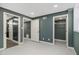 An open bedroom features neutral walls, recessed lighting, and multiple open doorways to other rooms at 1723 Capistrana Pl, Decatur, GA 30032