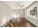 Sun-filled living room featuring hardwood floors, a ceiling fan, and ample natural light at 1723 Capistrana Pl, Decatur, GA 30032
