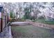 Landscaped backyard with tiered deck and privacy fence at 1330 Lockwood Sw Dr, Atlanta, GA 30311