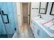 Modern bathroom with double vanity and a walk-in shower at 1330 Lockwood Sw Dr, Atlanta, GA 30311
