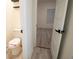 Simple bathroom with toilet and access to bedroom at 1330 Lockwood Sw Dr, Atlanta, GA 30311