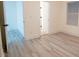 Bright bedroom with wood-look floors and access to bathroom at 1330 Lockwood Sw Dr, Atlanta, GA 30311