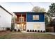 Two-story home with blue and white siding, balcony, and landscaped yard at 1330 Lockwood Sw Dr, Atlanta, GA 30311