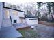 White garage with brick patio and exterior access at 1330 Lockwood Sw Dr, Atlanta, GA 30311