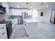 Modern kitchen with white cabinets, center island, and stainless steel appliances at 1330 Lockwood Sw Dr, Atlanta, GA 30311