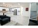 Open concept kitchen and living area with white cabinets and island at 1330 Lockwood Sw Dr, Atlanta, GA 30311