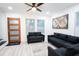 Bright living room featuring two sofas, a rug, and a world map print at 1330 Lockwood Sw Dr, Atlanta, GA 30311