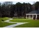 Curving pathway through a community park with benches and gazebo at 2116 Boxwood Se Cir, Conyers, GA 30094