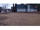 View of back yard and side of home with vinyl siding and dark shingled roof at 2562 Pendergrass Ct, Ellenwood, GA 30294