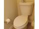 Simple bathroom with toilet and a roll of toilet paper at 2562 Pendergrass Ct, Ellenwood, GA 30294