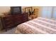 Bedroom features a large dresser, comfortable bed, and a relaxed atmosphere at 2562 Pendergrass Ct, Ellenwood, GA 30294