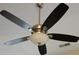 Modern ceiling fan with five dark blades and an elegant light fixture at 2562 Pendergrass Ct, Ellenwood, GA 30294