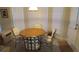 A dining area with a round table and chairs sits by bright windows at 2562 Pendergrass Ct, Ellenwood, GA 30294