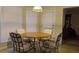 This dining area is illuminated by natural light, featuring a round table and elegant seating at 2562 Pendergrass Ct, Ellenwood, GA 30294