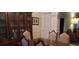Dining area with a wooden table, china cabinet, and classic decor at 2562 Pendergrass Ct, Ellenwood, GA 30294