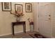 Charming entryway with a decorative table, floral arrangement, and tiled accents at 2562 Pendergrass Ct, Ellenwood, GA 30294