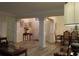 Elegant entryway with decorative columns, wood-look flooring, and a view of the dining area at 2562 Pendergrass Ct, Ellenwood, GA 30294