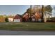 Lovely brick home with a well-kept lawn, two-car garage, and beautiful landscaping at 2562 Pendergrass Ct, Ellenwood, GA 30294