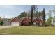 Attractive brick home boasting a two-car garage, tidy landscaping, and inviting curb appeal at 2562 Pendergrass Ct, Ellenwood, GA 30294