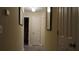 Well-lit hallway with multiple doors and modern lighting fixtures at 2562 Pendergrass Ct, Ellenwood, GA 30294