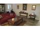Bright living room showcases wood-look floors, shuttered windows, and stylish accents at 2562 Pendergrass Ct, Ellenwood, GA 30294