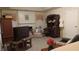 Cozy living room with a fireplace, plush seating, built-in bookshelves, and bright windows at 2562 Pendergrass Ct, Ellenwood, GA 30294