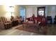 Inviting living room with wood-look floors, shutters, and comfortable seating at 2562 Pendergrass Ct, Ellenwood, GA 30294