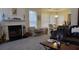 Inviting living space featuring a fireplace, open dining area, and comfortable seating arrangements at 2562 Pendergrass Ct, Ellenwood, GA 30294