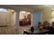 Inviting living space with dining area, decorative columns, and an open layout at 2562 Pendergrass Ct, Ellenwood, GA 30294