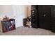Bright room featuring metal file cabinets and a tall cupboard, with boxes stacked near a doorway at 2562 Pendergrass Ct, Ellenwood, GA 30294
