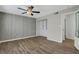 Bedroom with a spacious closet, ceiling fan, and ample lighting at 6940 Roswell Rd # E12, Atlanta, GA 30328