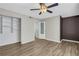 Bedroom featuring ample lighting, large closet, and clean flooring at 6940 Roswell Rd # E12, Atlanta, GA 30328