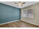Bedroom featuring clean flooring and a large window for natural light at 6940 Roswell Rd # E12, Atlanta, GA 30328