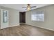 Bedroom with clean flooring, neutral walls, and ample light from a window at 6940 Roswell Rd # E12, Atlanta, GA 30328