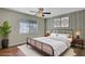 Nicely staged bedroom with decorative wall and natural lighting at 6940 Roswell Rd # E12, Atlanta, GA 30328