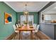 Dining room with stylish decor, a wooden table, and comfortable seating for an inviting atmosphere at 6940 Roswell Rd # E12, Atlanta, GA 30328