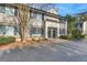Inviting two-story townhome with neutral siding, black shutters, and well-maintained landscaping at 6940 Roswell Rd # E12, Atlanta, GA 30328