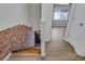 Stairwell featuring a brick wall and wood stairs at 6940 Roswell Rd # E12, Atlanta, GA 30328