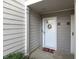 Inviting entryway with a wreath and colorful doormat at 75 Fair Haven Se Way, Smyrna, GA 30080